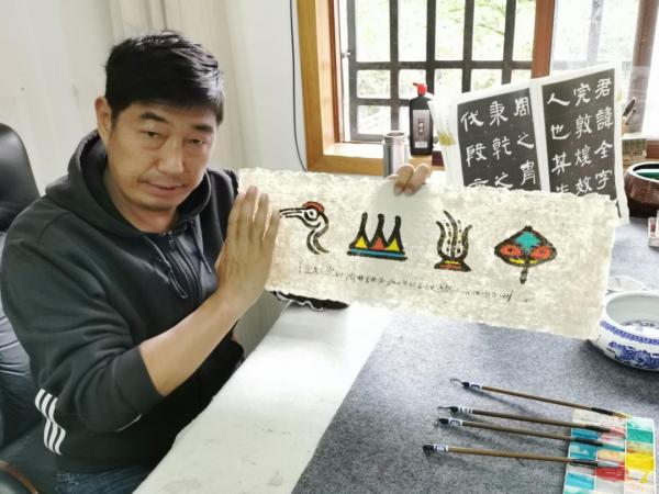 在雪山下探尋世界記憶遺產的真諦——訪麗江市東巴文化研究院 在雪山下探尋世界記憶遺產的真諦——訪麗江市東巴文化研究院