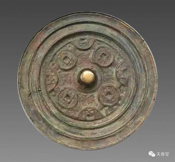 鏡子上的古錢 鏡子上的古錢