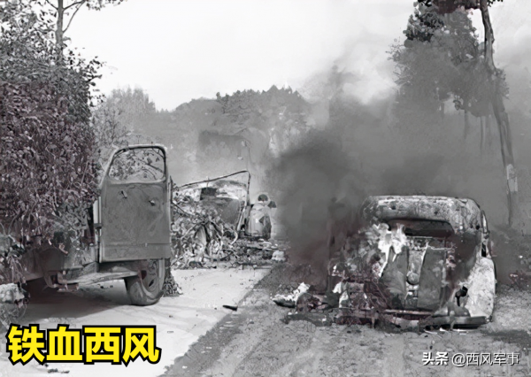 在通往布魯塞爾道路上燃燒的德國車輛