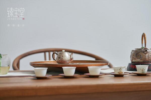 用一件精雕細刻的茶臺，來感受茶香氤氳