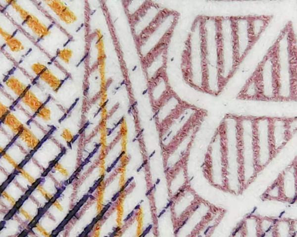 1975年2元《勞模王進喜》印刷油墨的對比