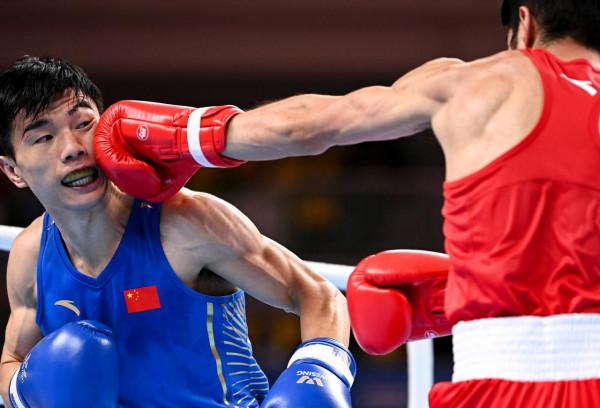 拳擊——男子52公斤級：胡建關奪冠